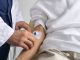 man with an IV in his forearm